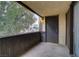 Enclosed balcony with concrete flooring and views of greenery and surrounding buildings at 1390 Vegas Valley Dr # 26, Las Vegas, NV 89169