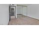 Bedroom with carpet, mirrored closet, and doorway to another room at 1390 Vegas Valley Dr # 26, Las Vegas, NV 89169
