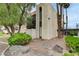 Charming townhome featuring a balcony, lush landscaping, and a private courtyard with rocks and plants at 1390 Vegas Valley Dr # 26, Las Vegas, NV 89169