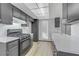 Modern kitchen featuring sleek countertops, black cabinets, and stainless steel appliances at 1390 Vegas Valley Dr # 26, Las Vegas, NV 89169
