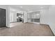 Bright living room featuring neutral decor, and an open layout to the dining and kitchen area at 1390 Vegas Valley Dr # 26, Las Vegas, NV 89169