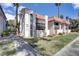 View of a charming two-story home featuring a well-maintained lawn and manicured landscaping at 1390 Vegas Valley Dr # 32, Las Vegas, NV 89169