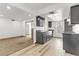 The kitchen has gray cabinets and countertops, adjacent to the living room and sunroom at 1390 Vegas Valley Dr # 32, Las Vegas, NV 89169