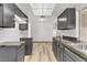 Bright kitchen with gray cabinetry and a practical layout, enhancing cooking and dining experiences at 1390 Vegas Valley Dr # 32, Las Vegas, NV 89169