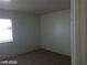 Cozy bedroom featuring a window for natural light and neutral carpet at 1405 Vegas Valley Dr # 360, Las Vegas, NV 89169