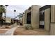 View of the apartment complex exterior with desert landscaping, palm trees, and walkway at 1405 Vegas Valley Dr # 360, Las Vegas, NV 89169