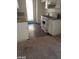 The bright kitchen has updated countertops, white cabinetry, and modern appliances at 1405 Vegas Valley Dr # 360, Las Vegas, NV 89169