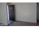 Open front door into living room of apartment with tan carpet and white walls at 1405 Vegas Valley Dr # 360, Las Vegas, NV 89169