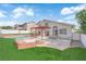 Expansive backyard with pool, grass, and patio at 1611 Buffalo Trail Dr, Henderson, NV 89014