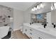 Elegant bathroom with double vanity, marble accents, and luxurious soaking tub at 1611 Buffalo Trail Dr, Henderson, NV 89014