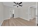 Bright bedroom with a ceiling fan and access to a modern en-suite bathroom at 1611 Buffalo Trail Dr, Henderson, NV 89014