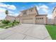 Charming home featuring a multi-car garage, tile roof, and well-maintained landscaping at 1611 Buffalo Trail Dr, Henderson, NV 89014