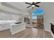 Eat-in kitchen with white cabinetry and island with gas stovetop at 1611 Buffalo Trail Dr, Henderson, NV 89014