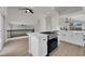 Kitchen featuring an island with cooktop and hardwood floors and an open floor plan at 1611 Buffalo Trail Dr, Henderson, NV 89014