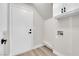 A laundry room with cabinets, access door, and plumbing for a washing machine and dryer at 1611 Buffalo Trail Dr, Henderson, NV 89014