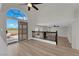 Spacious living room with sliding glass doors leading to the landscaped backyard at 1611 Buffalo Trail Dr, Henderson, NV 89014