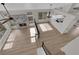 Open floor plan with fireplace, wood-look flooring, and stylish pendant lighting at 1611 Buffalo Trail Dr, Henderson, NV 89014