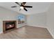 Living room featuring hardwood floors and a fireplace at 1611 Buffalo Trail Dr, Henderson, NV 89014