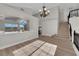 Open floor plan living area with staircase and lots of natural light at 1611 Buffalo Trail Dr, Henderson, NV 89014