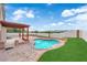 Backyard with a pergola covered patio, pool, and turf at 1611 Buffalo Trail Dr, Henderson, NV 89014