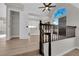View of the white kitchen from the staircase at 1611 Buffalo Trail Dr, Henderson, NV 89014