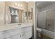 Bathroom features a large mirror, vanity, and a shower/tub combo with sliding glass doors at 1628 Justin Ct # 18, Henderson, NV 89011