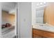 Functional bathroom with a vanity, wall mirror, and framed decor, showcasing a practical design at 1628 Justin Ct # 18, Henderson, NV 89011