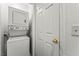 Stacked washer and dryer in a designated laundry area, providing convenience and space-saving design at 1628 Justin Ct # 18, Henderson, NV 89011