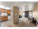 Living room features a stone fireplace, neutral carpet, and natural lighting from the multiple windows at 1628 Justin Ct # 18, Henderson, NV 89011