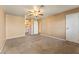Spacious main bedroom features neutral walls, carpet, a ceiling fan, and an attached bathroom at 1628 Justin Ct # 18, Henderson, NV 89011