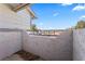 Private patio with a textured wall, providing an intimate outdoor space and neighborhood views at 1628 Justin Ct # 18, Henderson, NV 89011