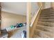 Carpeted staircase leading to the upper level, complemented by neutral wall tones at 1628 Justin Ct # 18, Henderson, NV 89011