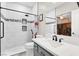 Modern bathroom with stylish tile shower, updated fixtures, and gray vanity at 1763 Crystal Stream Ave, Henderson, NV 89012