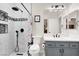 Modern bathroom with stylish tile shower, updated fixtures, and gray vanity at 1763 Crystal Stream Ave, Henderson, NV 89012