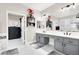 Spacious bathroom with a tub, glass shower, dual vanity, and closet at 1763 Crystal Stream Ave, Henderson, NV 89012