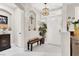 Inviting foyer with decorative lighting, arched entryway, and elegant decor at 1763 Crystal Stream Ave, Henderson, NV 89012