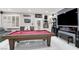 Spend hours enjoying this game room with a pool table and modern media center for entertaining at 1763 Crystal Stream Ave, Henderson, NV 89012
