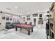 This game room has a beautiful pool table, bright lighting, and relaxing chairs to make it the perfect space at 1763 Crystal Stream Ave, Henderson, NV 89012