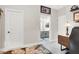 Hallway view of the bathroom featuring a gray vanity and bright lighting at 1763 Crystal Stream Ave, Henderson, NV 89012