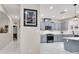 Bright eat-in kitchen features stainless steel appliances, ample counter space, and stylish gray cabinets at 1763 Crystal Stream Ave, Henderson, NV 89012