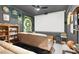 Home theater with large screen, comfortable seating, and sports memorabilia at 1763 Crystal Stream Ave, Henderson, NV 89012