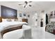 Spacious main bedroom features a comfortable bed, shutters, and an seating area at 1763 Crystal Stream Ave, Henderson, NV 89012