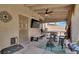 Covered patio with ceiling fan, TV, and ample seating at 1763 Crystal Stream Ave, Henderson, NV 89012