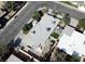 Overhead view of the property showcasing its gray roof, landscaped backyard with a patio and neighborhood views at 1819 Beverly Way, Las Vegas, NV 89104