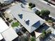 Aerial view of the home showcasing its expansive roof, landscaped yard, backyard patios, and surrounding neighborhood at 1819 Beverly Way, Las Vegas, NV 89104