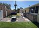 Beautiful backyard with artificial grass, stone landscaping, and outdoor kitchen at 1819 Beverly Way, Las Vegas, NV 89104