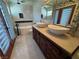 A luxurious bathroom featuring a soaking tub and dual sinks on a granite counter at 1819 Beverly Way, Las Vegas, NV 89104