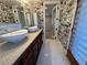 Bathroom featuring a granite countertop and dual sinks at 1819 Beverly Way, Las Vegas, NV 89104