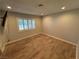 Bright bedroom features wood-look flooring and shuttered windows at 1819 Beverly Way, Las Vegas, NV 89104