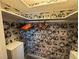 Spacious closet featuring custom wallpaper and orange hangers at 1819 Beverly Way, Las Vegas, NV 89104